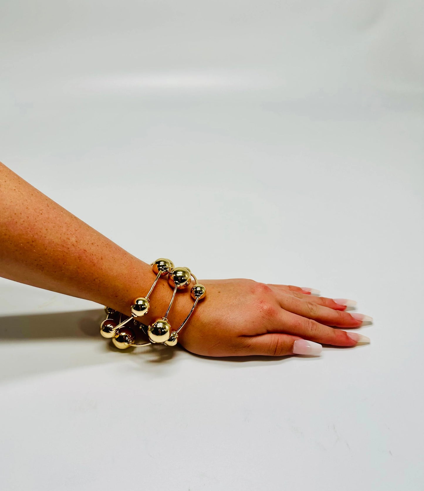 Orbital Flow Gold Cuff Bracelet with Sculptural Orbs
