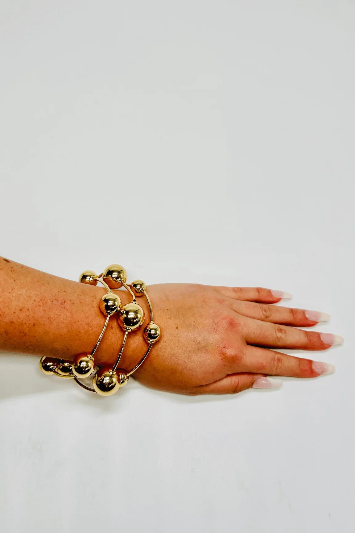 Orbital Flow Gold Cuff Bracelet with Sculptural Orbs